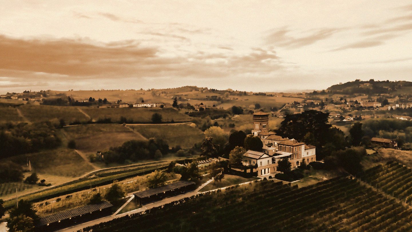 A wine-country estate with vineyards rolling to the hills