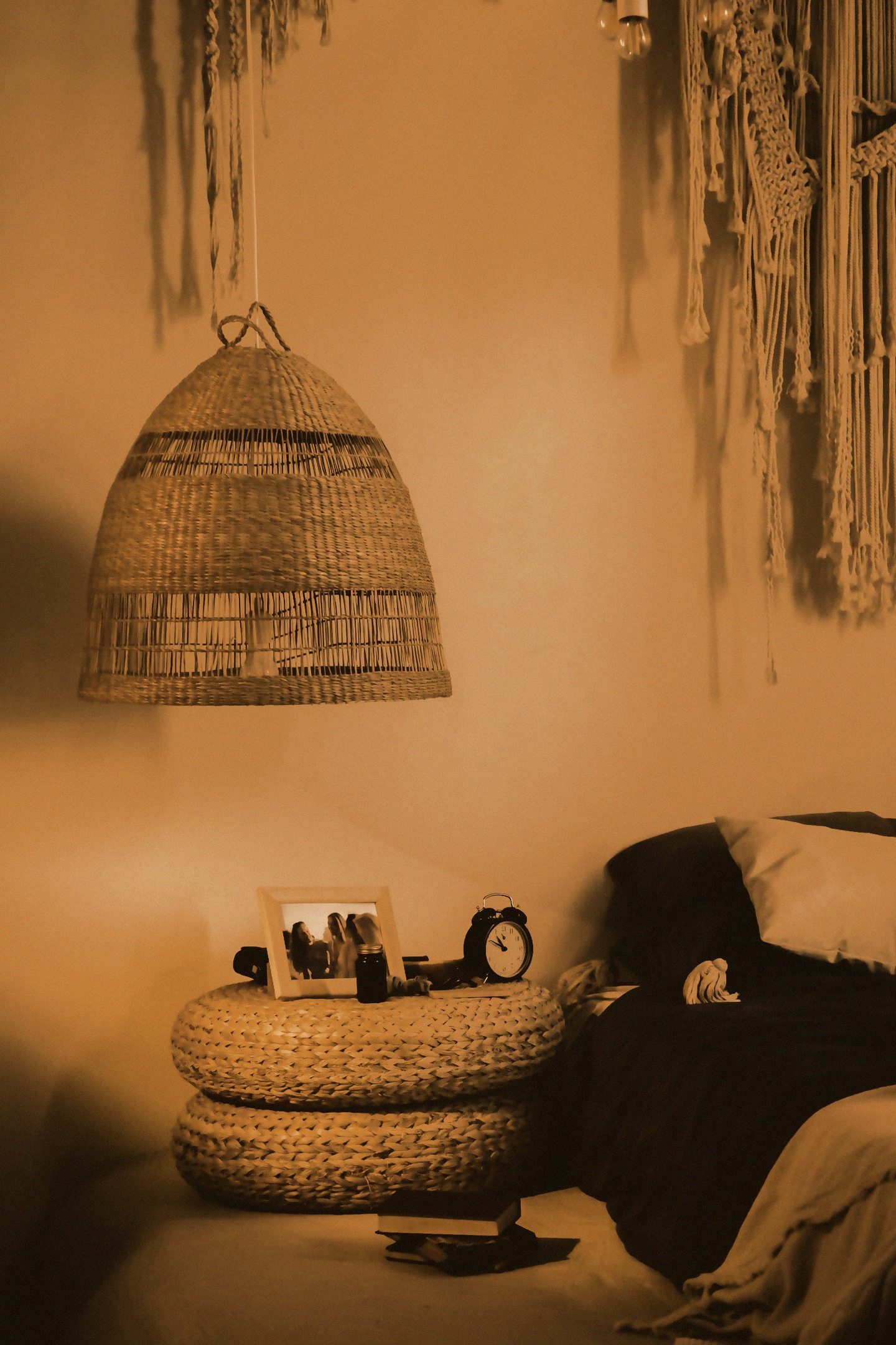 Boho corner with rattan lamp and warm light