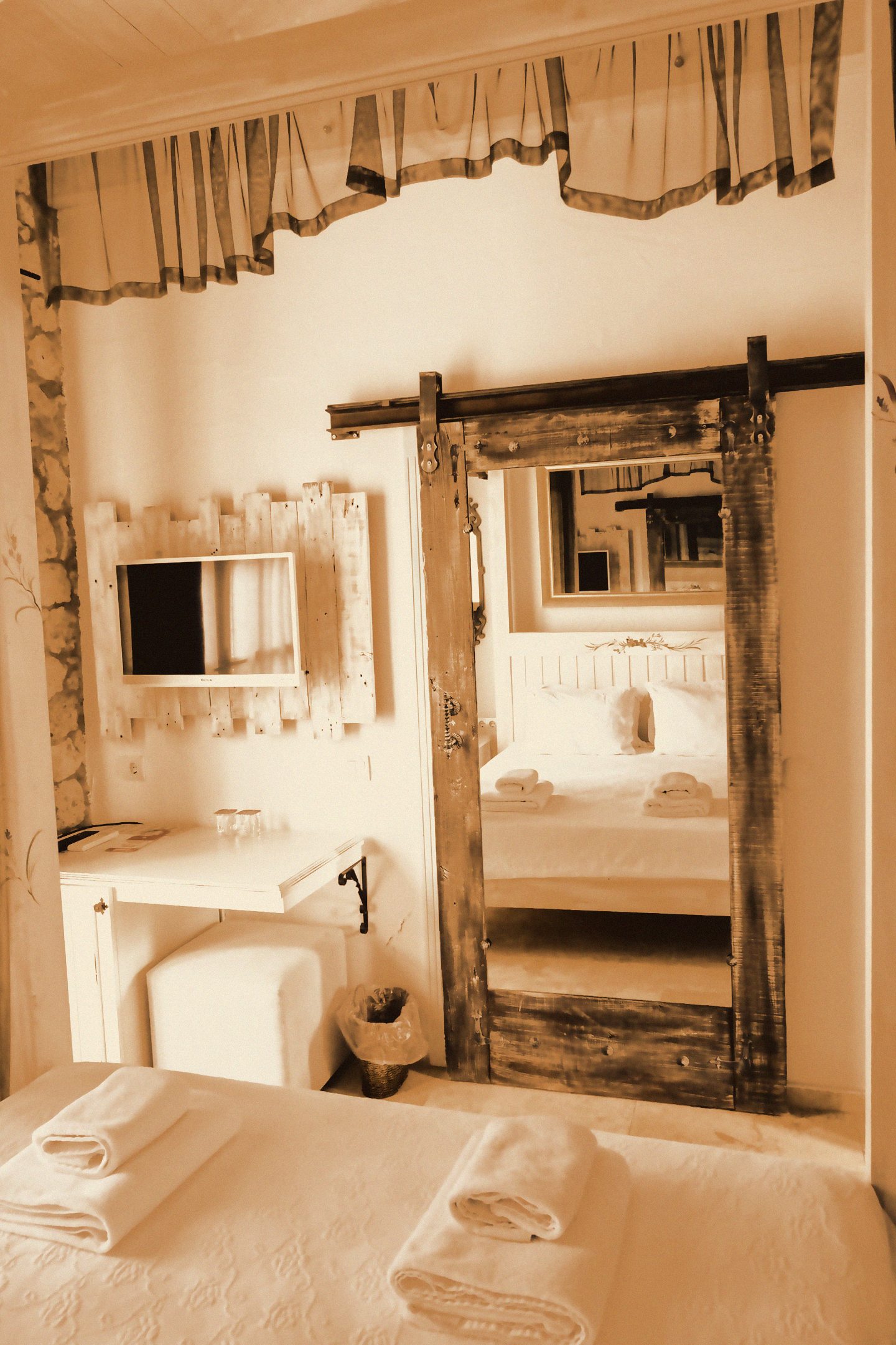 Rustic white room with vintage wooden doors